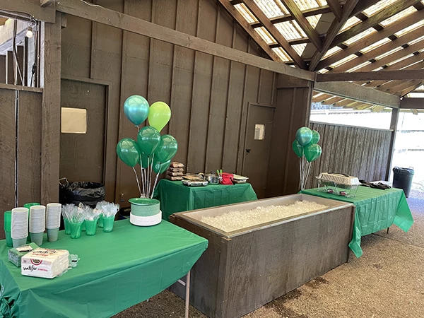 Tables set up in Alderbrook Venue 2 for food and drinks with a big trough of ice