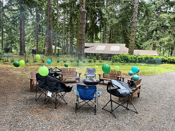 Fire pit surrounded by comfortable chairs at Alderbrook Venue 2