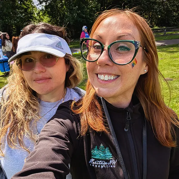 Two Heritage employees take a selfie style photo.