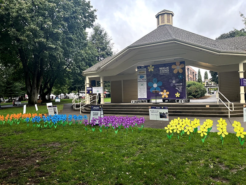 The Promise Garden with flowers grouped by color, orange, blue, purple, and yellow